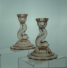 #109 Petticoat Dolphin Candlesticks with flared base, 6.5 inch, Flamingo, 1925-1935